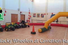 Mini Jeeps and racing decorations inside Carnation Hall