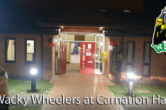 Illuminated entrance to Carnation Hall party venue at night