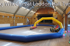 Indoor mini Jeep circuit with chequered bunting at Loddon Hall