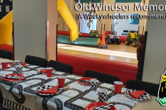 Birthday party table beside mini Jeep circuit at Old Windsor Memorial Hall