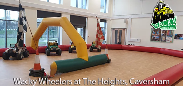 Fun-filled jeep driving party at The Heights School with a room full of inflatable obstacle course for kids